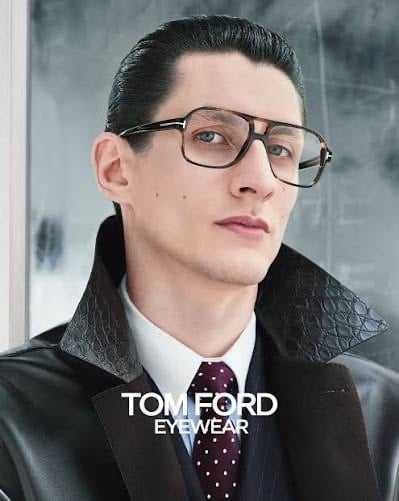Model wearing Tom Ford navigator eyeglasses with precision lenses